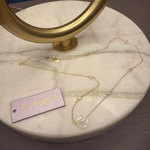 14KPlated 925 Necklace with mother of pearl Flower Pendant and cubic zirconias.